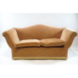 A camel back two seat sofa with apricot velvet covering, overall 78cm high, 180cm wide,