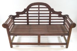 A pair of teak 'Lutyens' style garden benches, 106cm high,