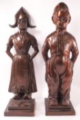 A pair of bronzed metal Art Deco fireside companion sets in the form of a Dutch boy and girl