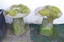 A pair of reconstituted stone staddlestones, 57cm high,