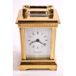 A brass cased miniature carriage clock (with key), by David Peterson,