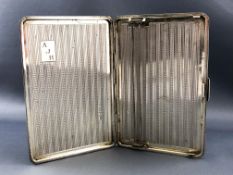 A silver cigarette case in the Art Deco style of rectangular form