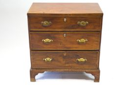 A nineteenth century chest of three drawers, with boxwood stringing on bracket feet, 86cm high,