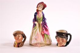 A Royal Doulton figure 'The Paisley Shawl' and two miniature character jugs,