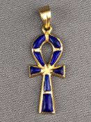 A yellow metal ankh pendant set with lapis lazuli (untested) No hallmark.