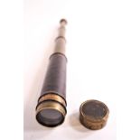 A leather cased thee pull brass telescope,