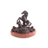 A cast metal desk stand in the form of a rearing horse with two pen holders (?), signed Mene,