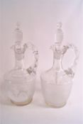 A pair of Mary Gregory style decanters and stoppers, a vase with a boy holding a racquet and a jug,