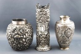 A Carolean style white metal ginger jar repousse decorated with extensive floral work,