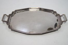 A shaped silver two handled Art Deco tray of contrived octagonal form, Birmingham, 1932, 48cm,