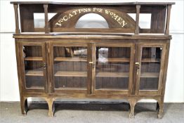 A large painted side cabinet with the raised back inscribed Vocations for Women,