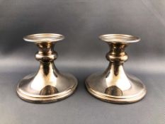 A pair of silver low squat loaded baluster candlesticks, Birmingham 20th,