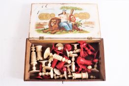 A 19th century red stained and carved natural ivory chess set of turned and carved form,