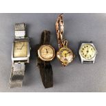 A collection of four wristwatches of variable designs, two are hallmarked 9ct gold.