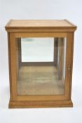 An oak framed taxidermy display case, with flared cornice, 77cm high, 61cm wide,