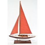 A Nauticalia wooden model pond yacht on stand,