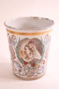 An 1897 enamel tin beaker, polychrome transfer decorated with a scene of Windsor Castle,