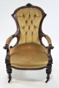 A ladies nineteenth century carved mahogany arm chair with framed back