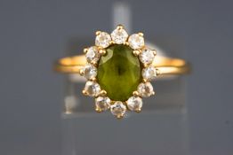 A yellow metal cluster ring.