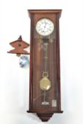 A Franz Hermle 8 day chain driven regulator in mahogany case, with enamel dial,