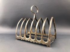 A plain silver six slice plain toast rack with strap handle by Dixon and Sons Sheffield 1905,