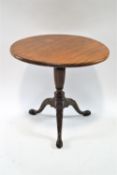 An Edwardian mahogany tripod table, on reeded pedestal on cabriole legs with pad feet, 72cm high,
