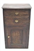 A Victorian pine cupboard with two drawers above a panelled door, 106cm high, 64cm wide,
