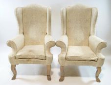 A pair of 20th century wing back armchairs on carved and painted legs, 82cm high, 92cm wide,