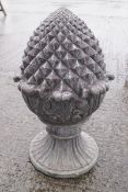 A cast iron pineapple finial, with simulated lead patina,