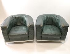 A chrome framed and green leather two seat sofa and two matching armchairs