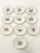 A porcelain Dresden service comprising ten plates printed and painted with flowers within gilt