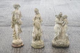 Three composite garden statues,