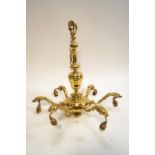 A brass six branch hanging chandelier fitted with glass shades, cast dolphins to branches,