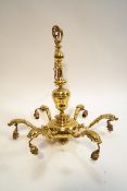 A brass six branch hanging chandelier fitted with glass shades, cast dolphins to branches,