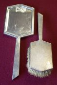 An Art Deco silver part dressing table set of shaped hexagonal form,