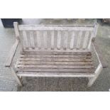 A wooden garden bench (cushion in reception),