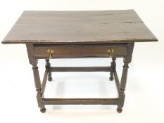 An 18th century oak side table on turned legs,