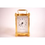 A carriage clock in gilt four glass case, the dial marked Fox & Simpson,