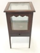 A mahogany framed display table with one frieze drawer on square tapering legs,