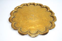 A Middle Eastern brass lobed tray,