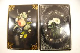 Two 19th century papier mache blotters each painted with flowers