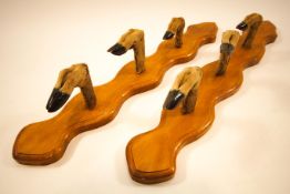 A pair of deer slot whip racks on shaped oak boards,