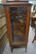 An Edwardian mahogany display cabinet on square tapering legs and spade feet