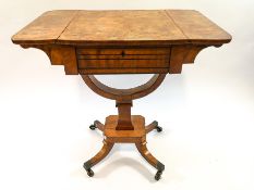 A late Regency satinwood work table, with drop ends,