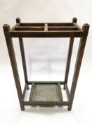 An oak stick stand with four section divides,