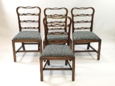 A set of six mahogany dining chairs with pierced ladder backs,