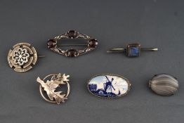 A collection of six white metal dress brooches of variable design. Some are marked 925 Silver.