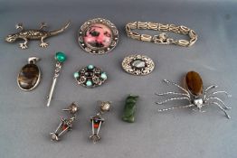 A collection of Jewellery to include six brooches, a Zoltan white silver and paste brooch,