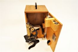 A Louis Preunchoff monocular microscope (German) in associated case with assorted lenses,