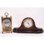 A brass cased Koma 400 day clock with glass sides,